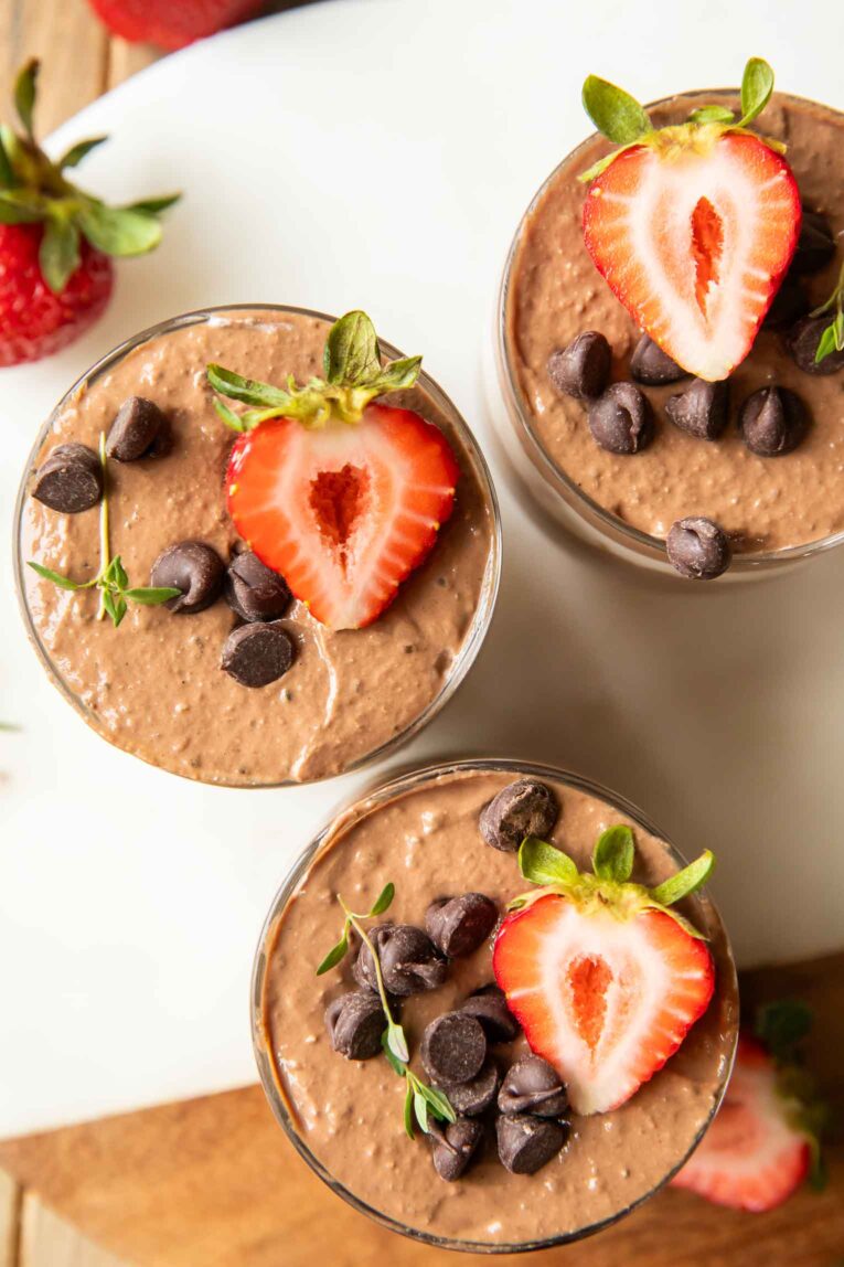 Top view of Chocolate Mousse Parfaits on a cuttings board.