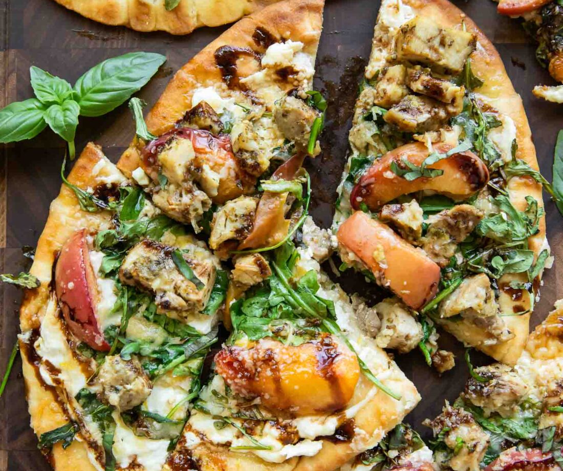 Balsamic Peach Chicken Flatbread pizza cut into triangles.