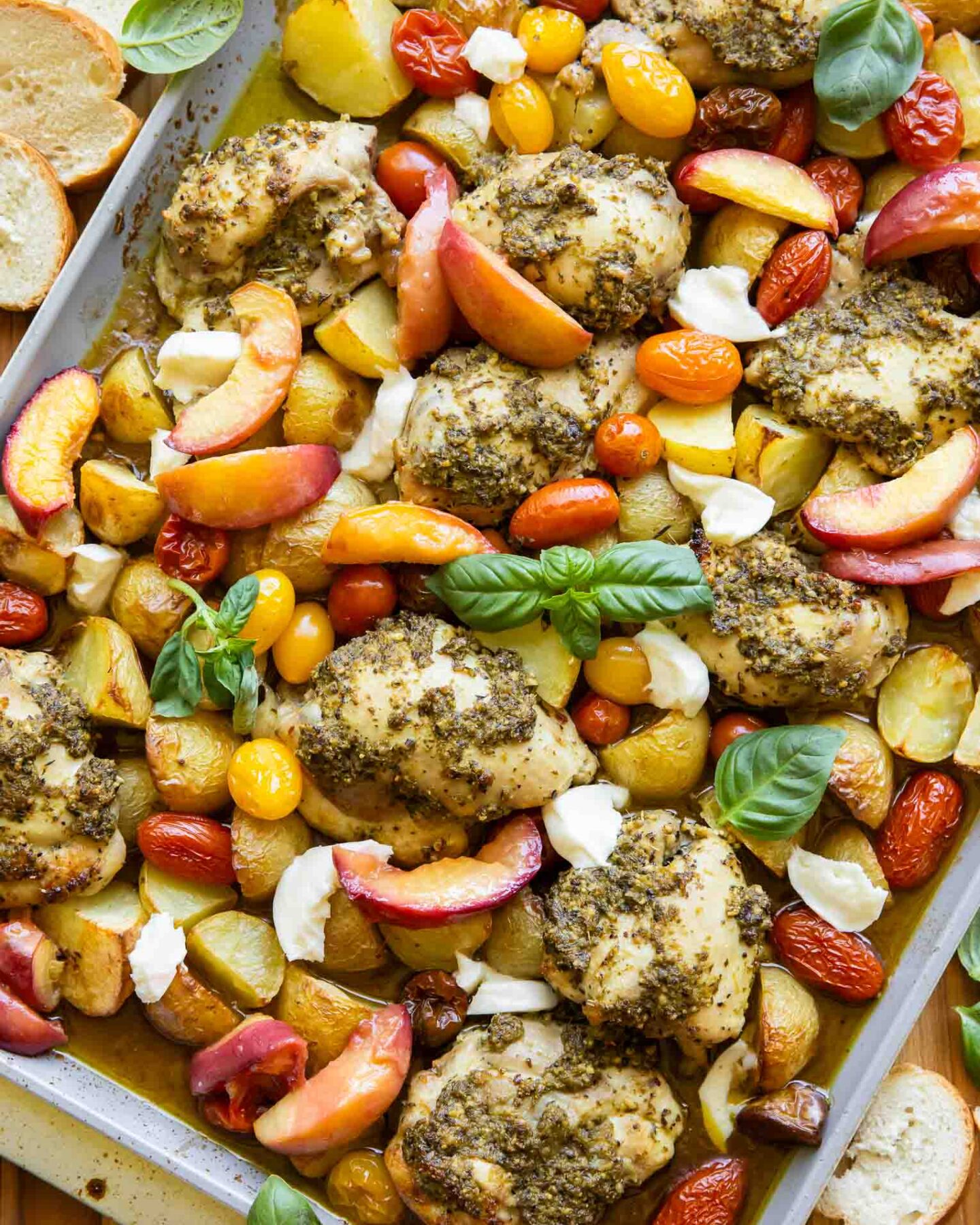 Chicken and veggies on a sheet pan.