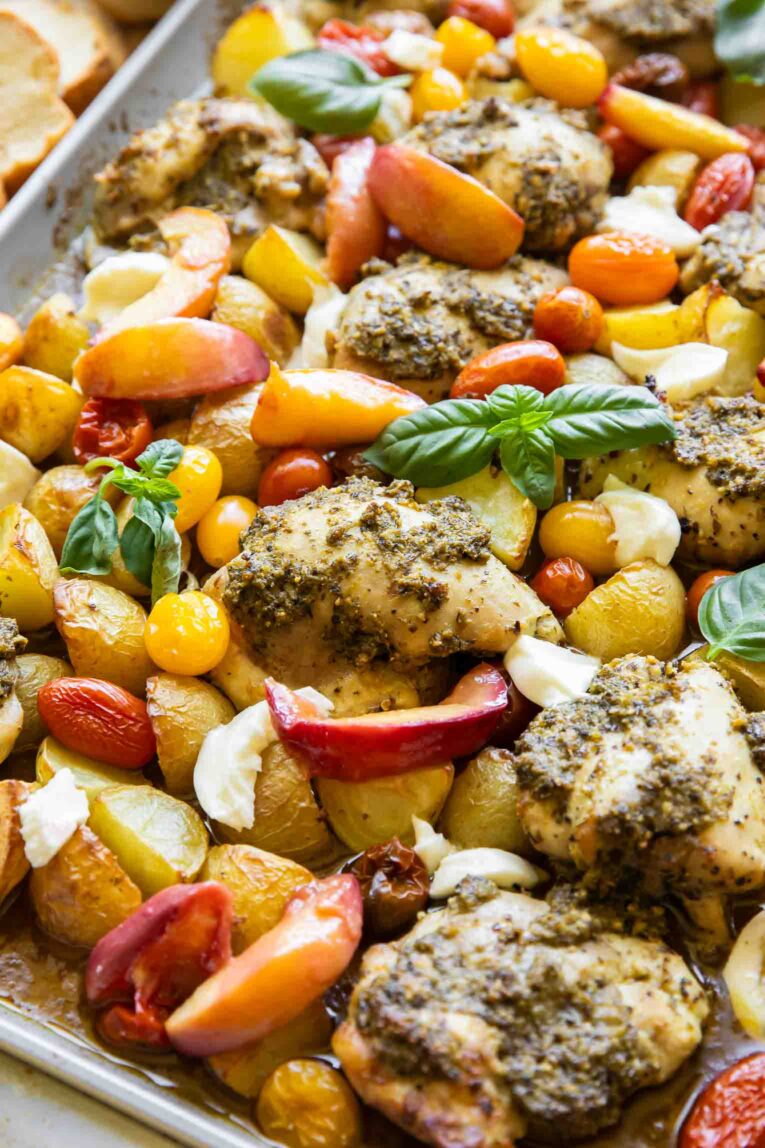 Chicken and veggies on a sheet pan.