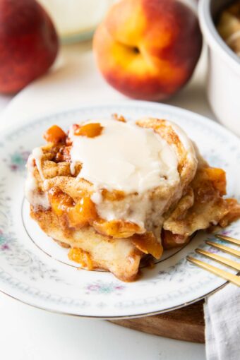 Brown Sugar Peach Cinnamon roll on a plate.