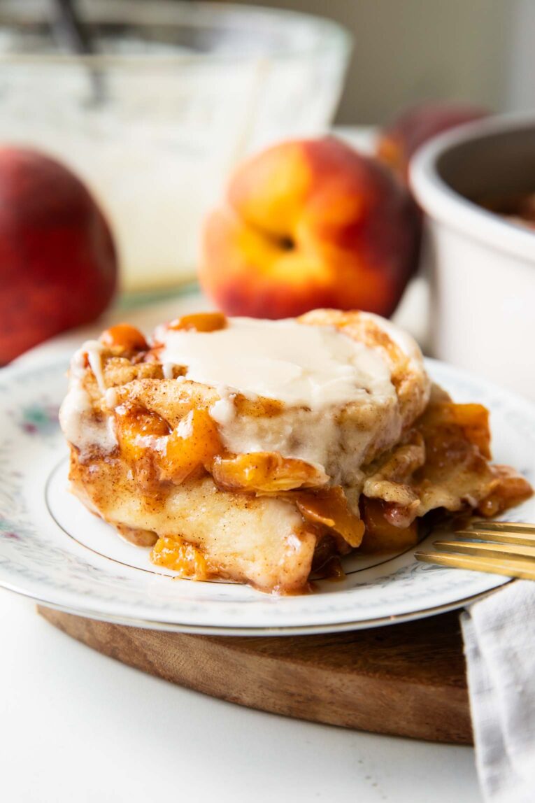 Brown Sugar Peach Cinnamon roll on a plate.
