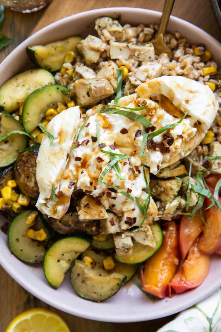 Honey honey peach burrata in a bowl.