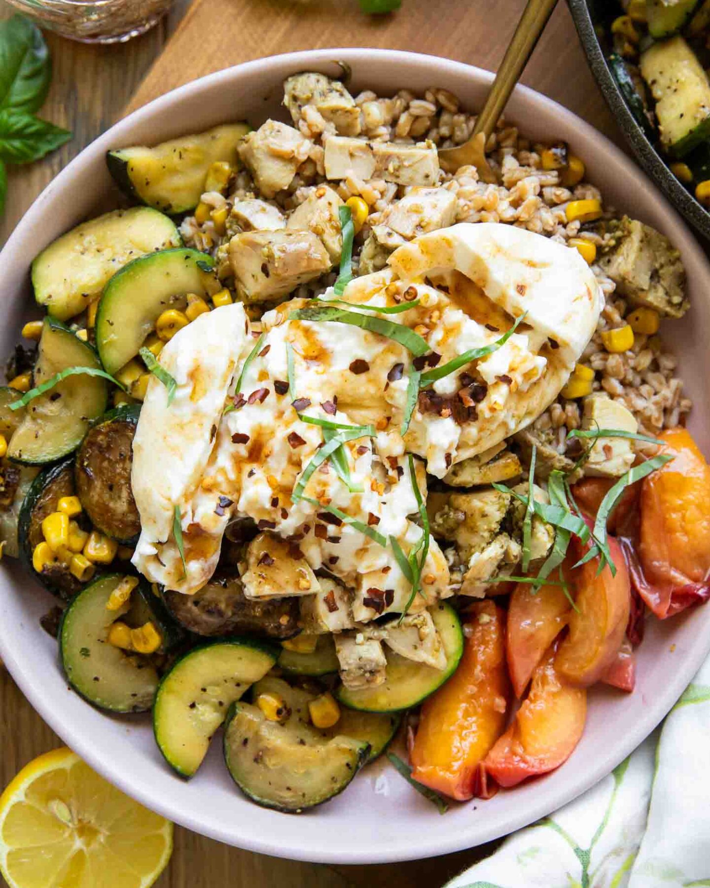 Honey honey peach burrata in a bowl.