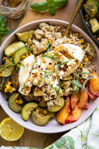 Honey honey peach burrata in a bowl.