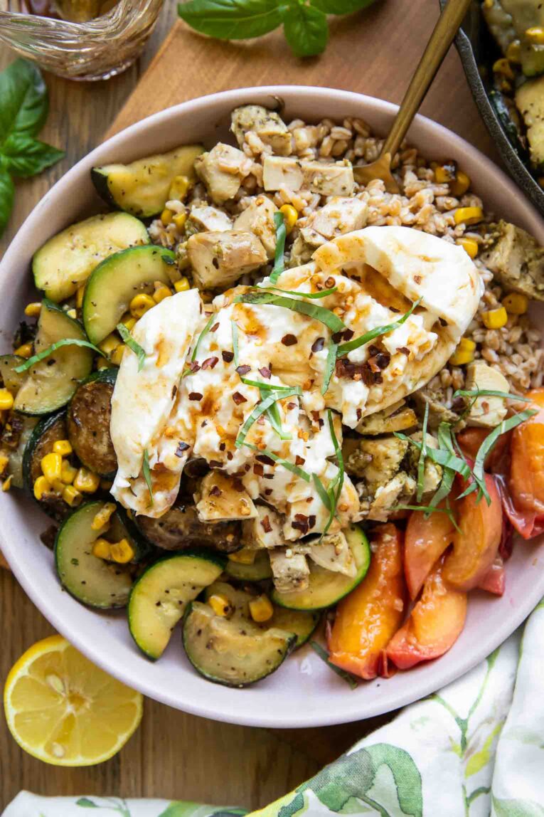Honey honey peach burrata in a bowl.