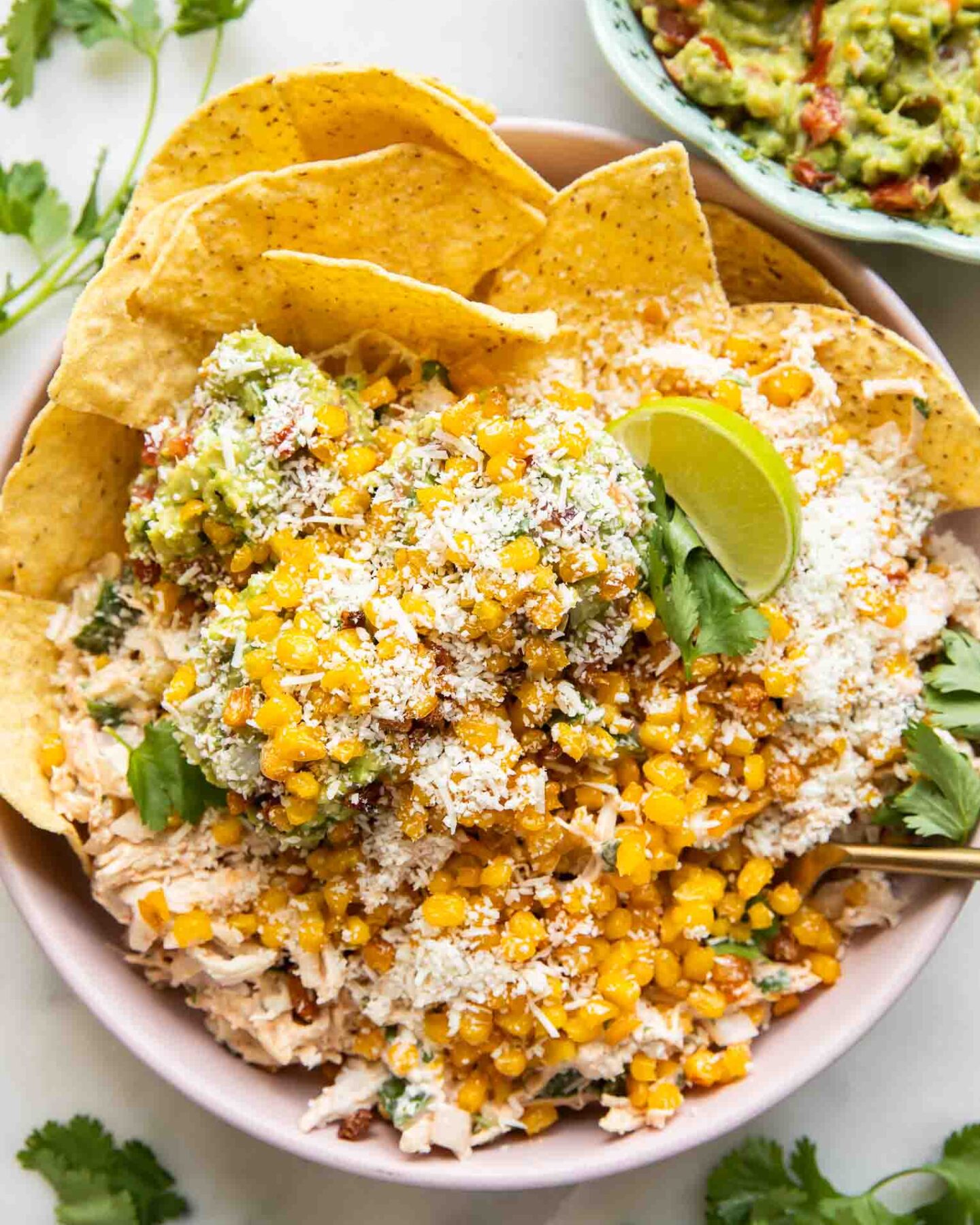 Guacamole crispy sweetcorn chicken salad in a bowl.