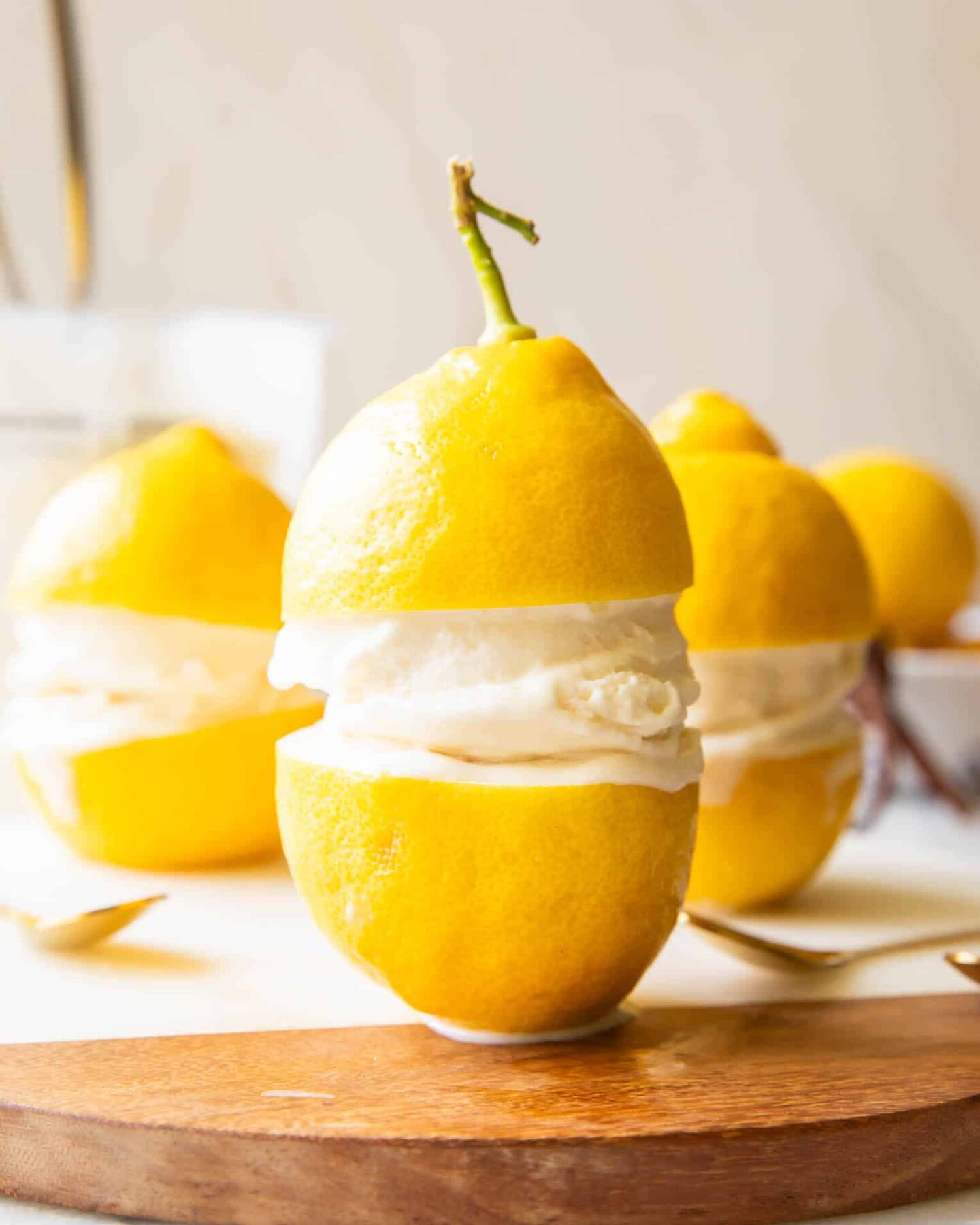 Limoncello Ice Cream in between two lemons.