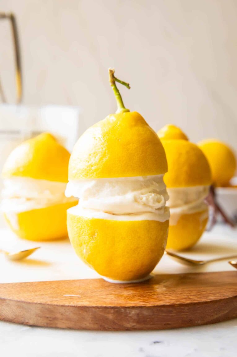 Limoncello Ice Cream in between two lemons.