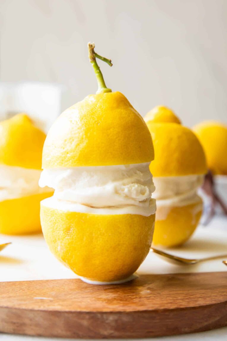 Limoncello Ice Cream in between two lemons.