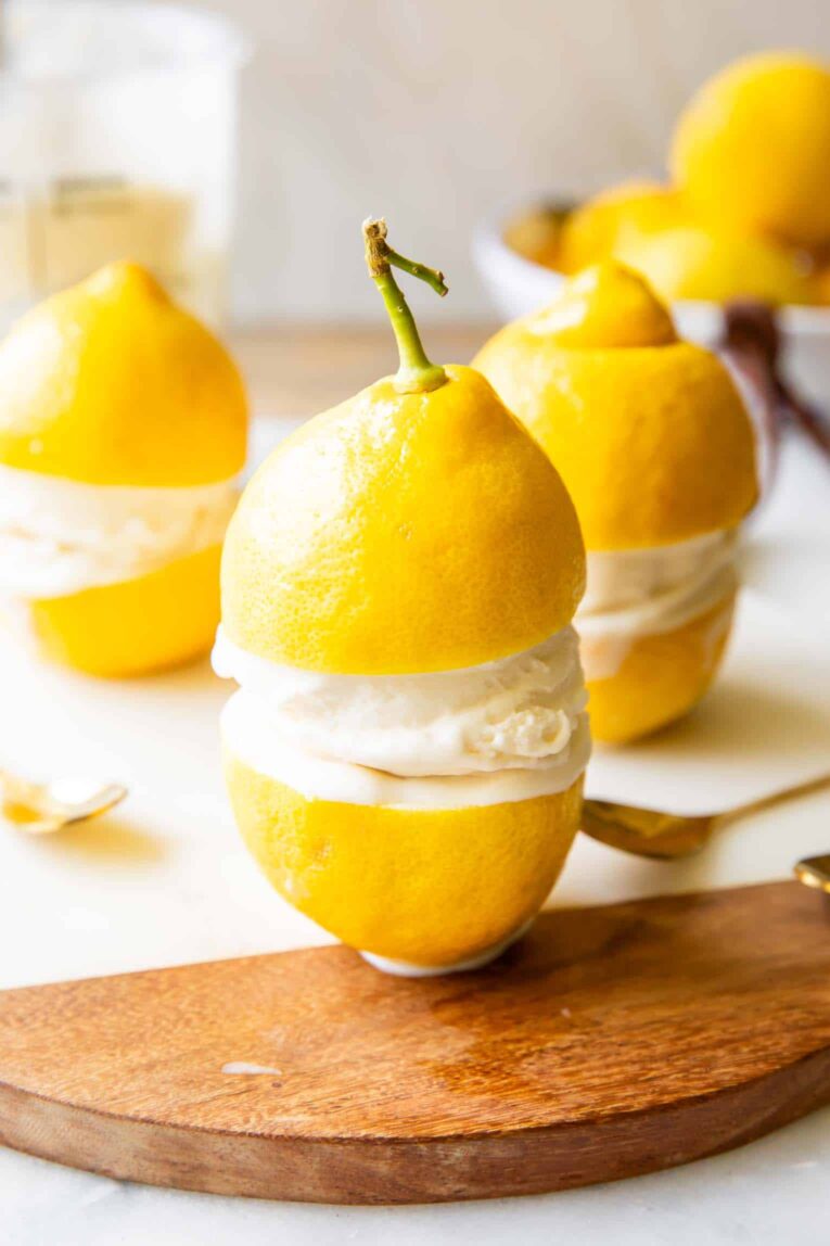Limoncello Ice Cream in between two lemons.