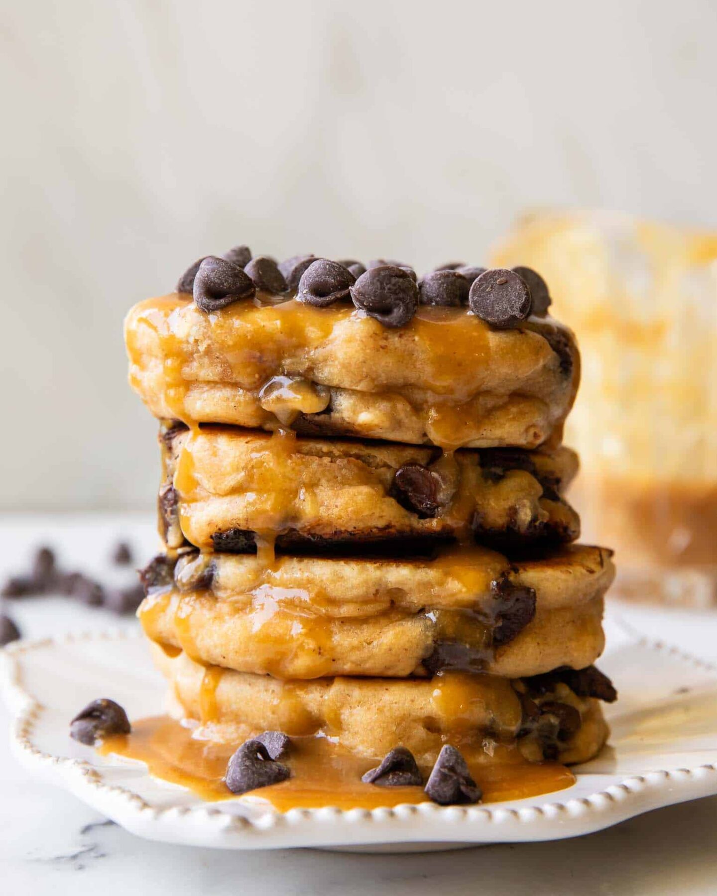 A stack of Peanut Butter Chocolate Chip Pancakes on a plate.