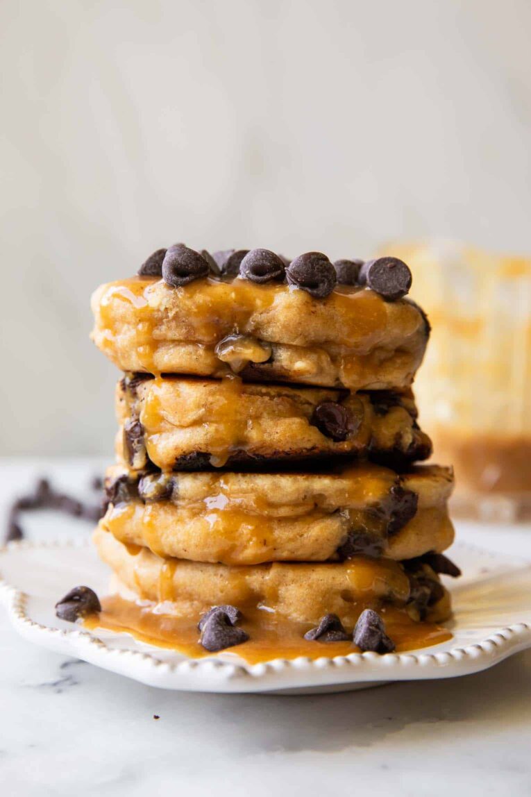 A stack of Peanut Butter Chocolate Chip Pancakes on a plate.