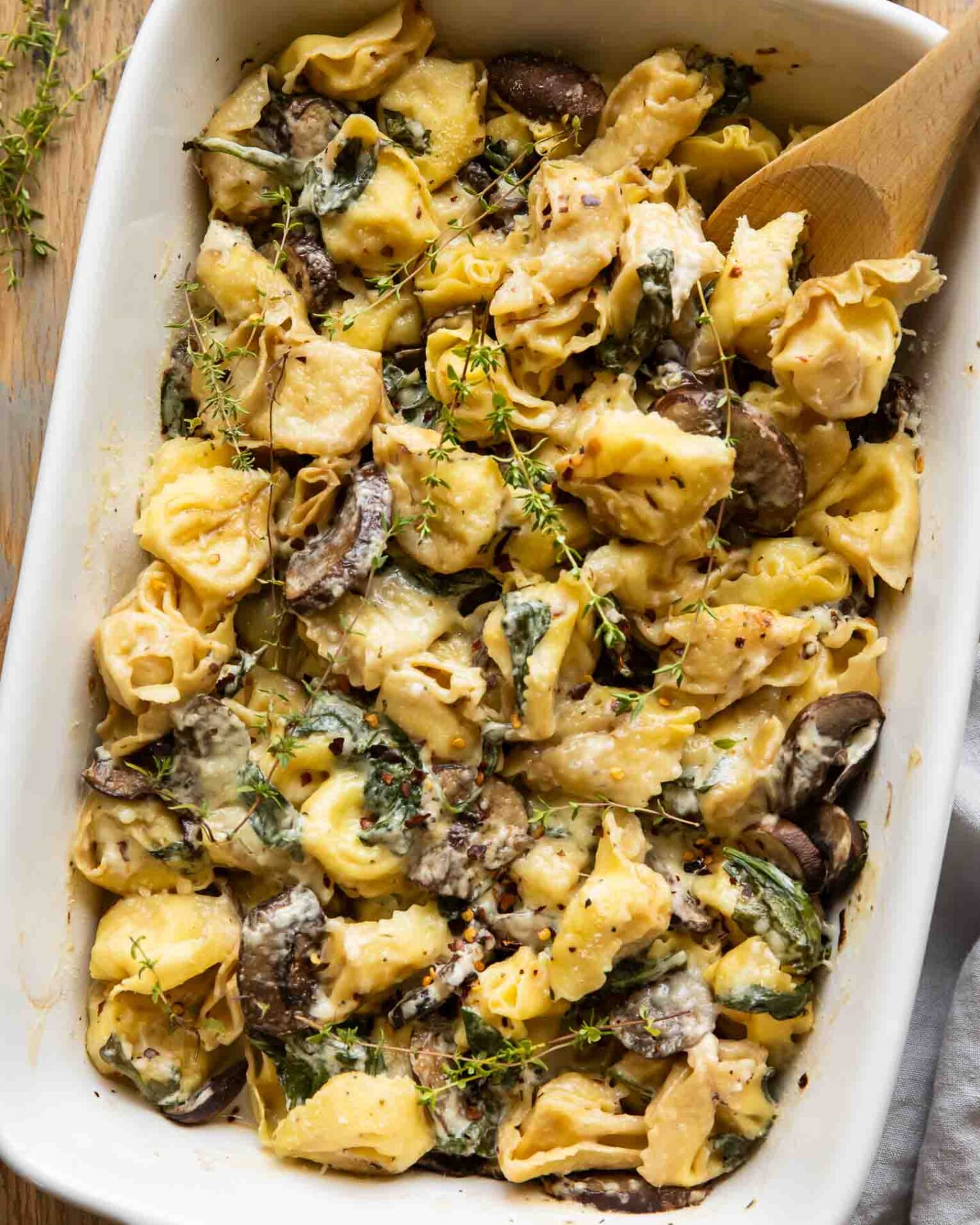 Spinach & Mushroom Tortellini Bake in a baking dish.