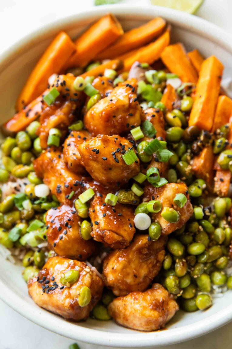 Sticky Sriracha Honey Chicken in a bowl.